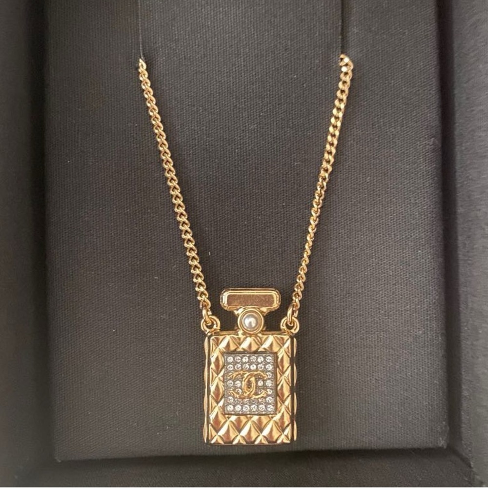 New authentic Chanel CC perfume bottle crystals faux pearl necklace Gold color